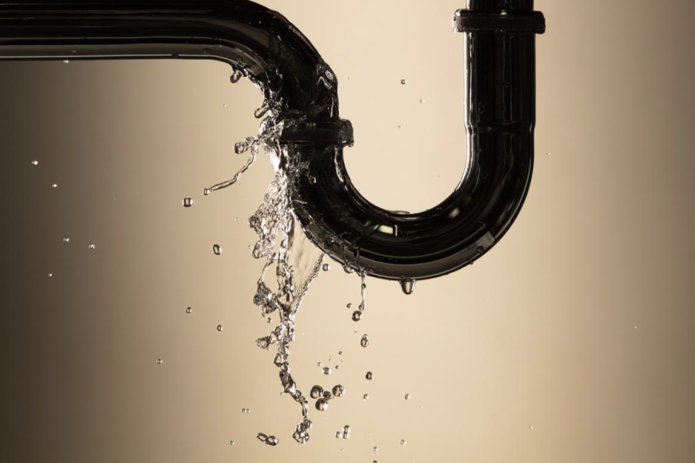 Water spraying from a leaking pipe joint, a plumbing emergency in Santa Barbara.