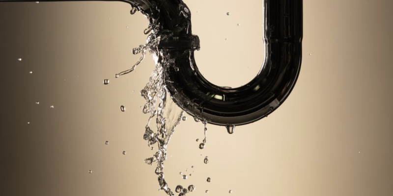 Water spraying from a leaking pipe joint, a plumbing emergency in Santa Barbara.
