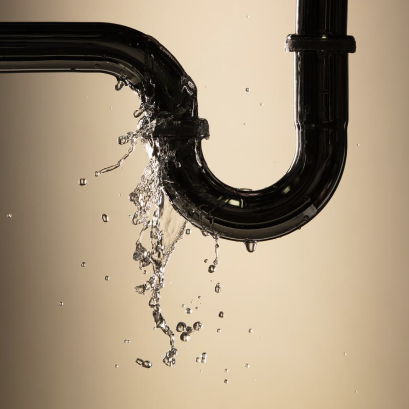 Water spraying from a leaking pipe joint, a plumbing emergency in Santa Barbara.